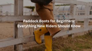 Beginner rider wearing leather paddock boots during a horse riding lesson at an equestrian stable.